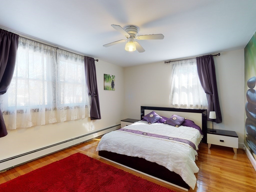 30 Kingston Road Waltham, MA 02451 - Photo 30 of 41 a bedroom with a bed and a window