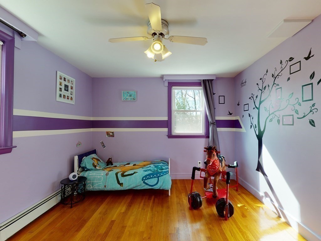 30 Kingston Road Waltham, MA 02451 - Photo 33 of 41 a living room with furniture and a chandelier
