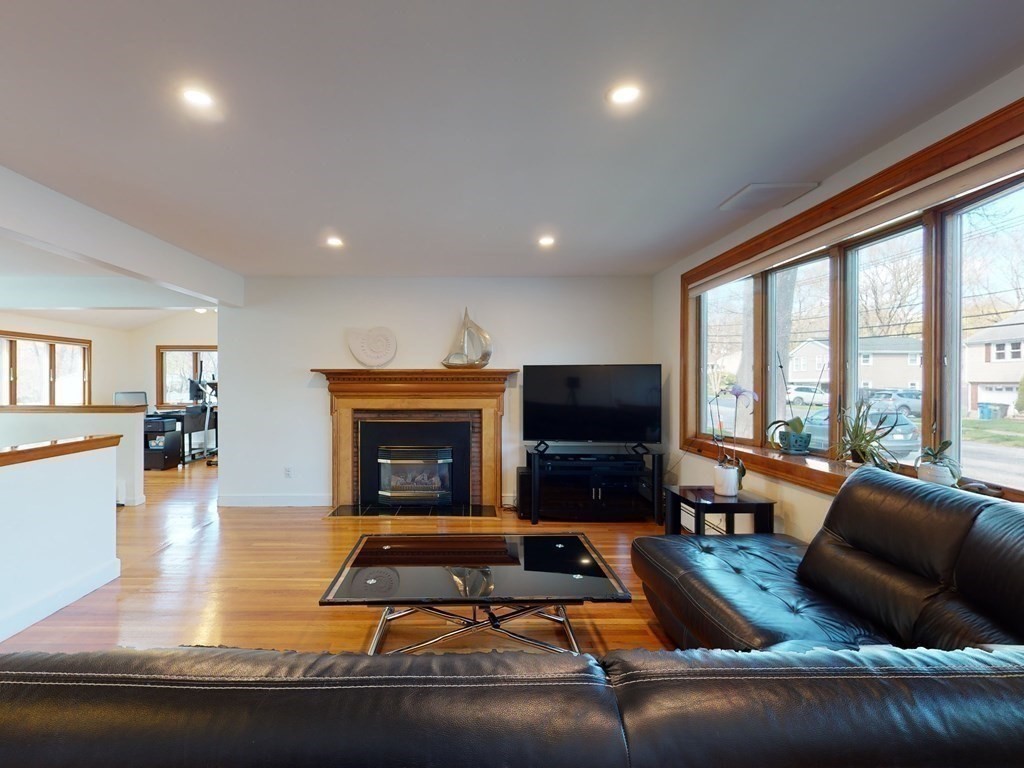 30 Kingston Road Waltham, MA 02451 - Photo 5 of 41 a living room with furniture window and a fireplace