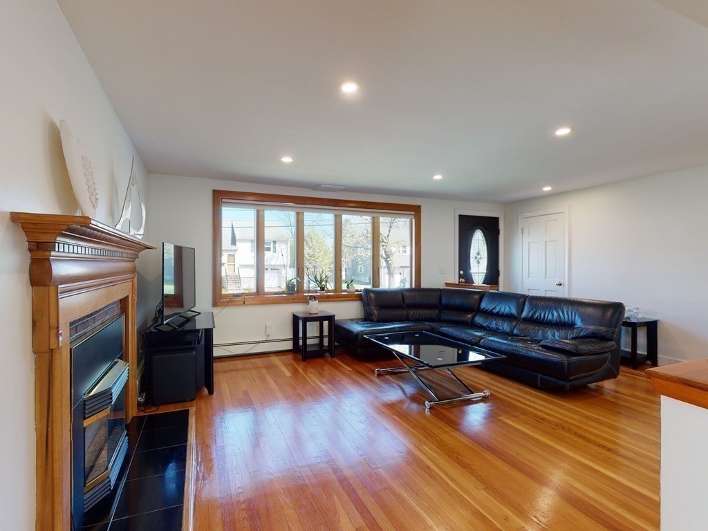 30 Kingston Road Waltham, MA 02451 - Photo 8 of 41 a living room with furniture and a wooden floor