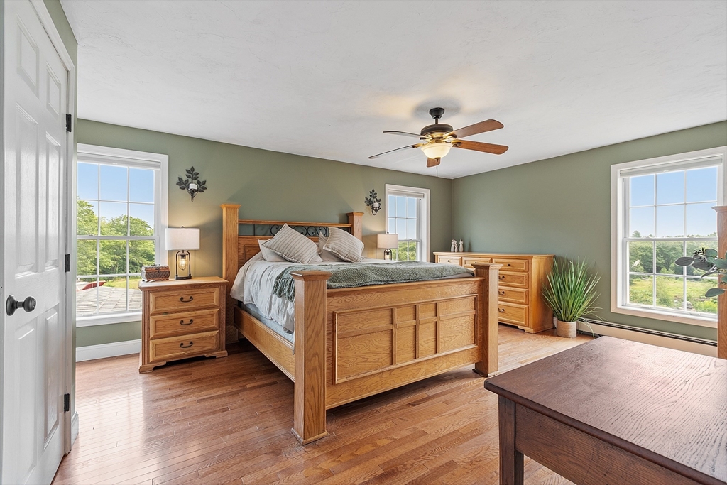 11 Syd Smith Road Westminster, MA 01473 - Photo 14 of 42 a bedroom with a bed and a chandelier