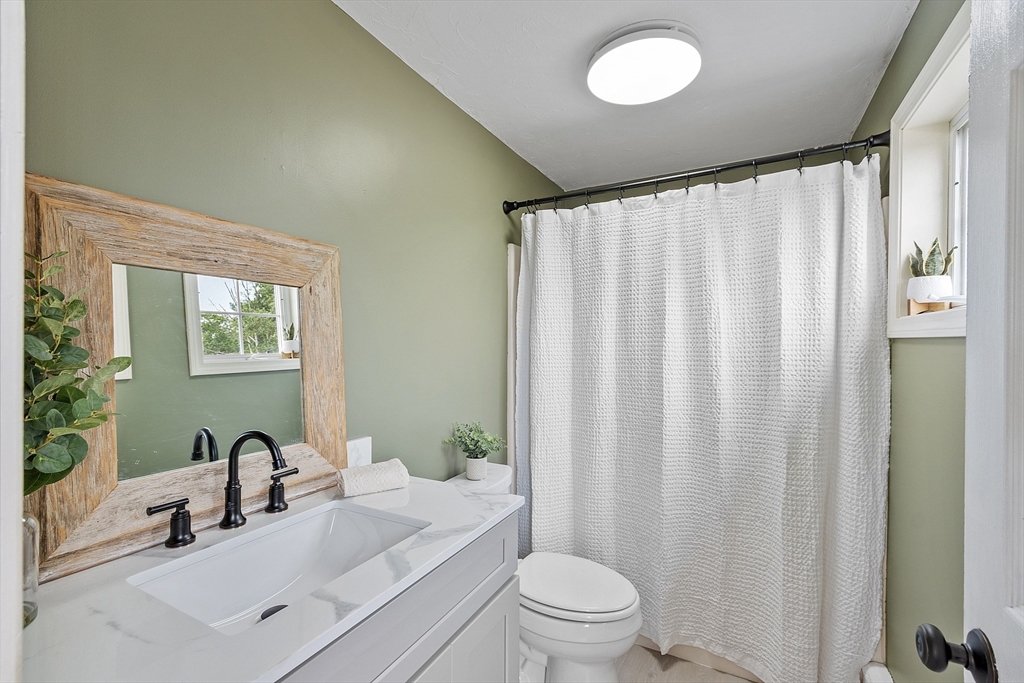 11 Syd Smith Road Westminster, MA 01473 - Photo 15 of 42 a bathroom with a sink a toilet and a mirror