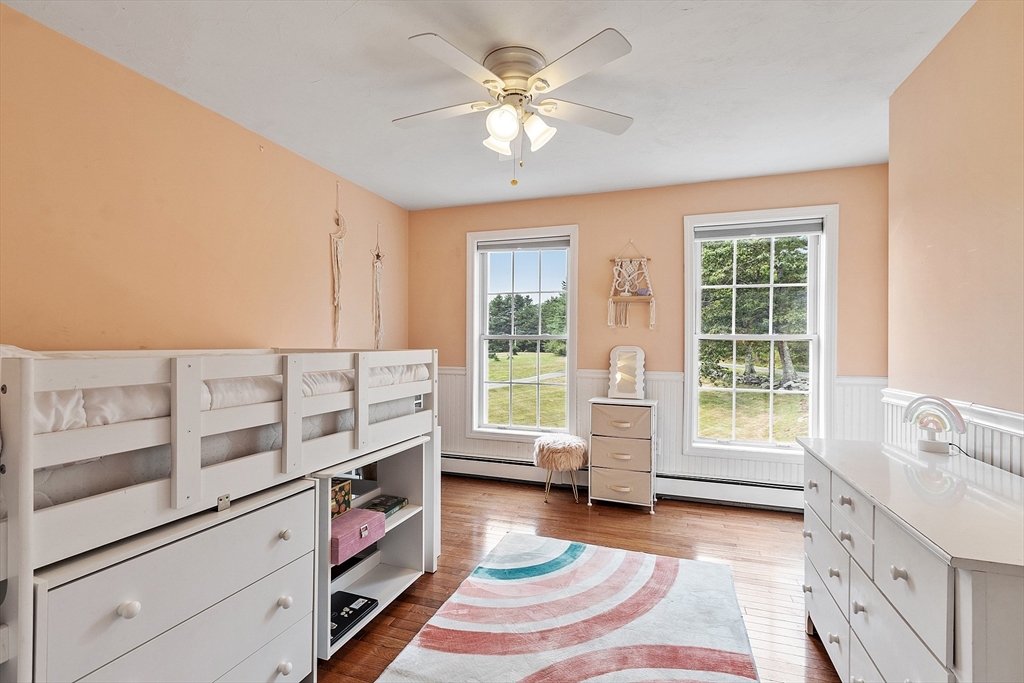 11 Syd Smith Road Westminster, MA 01473 - Photo 18 of 42 a spacious bedroom with a bed and a chandelier