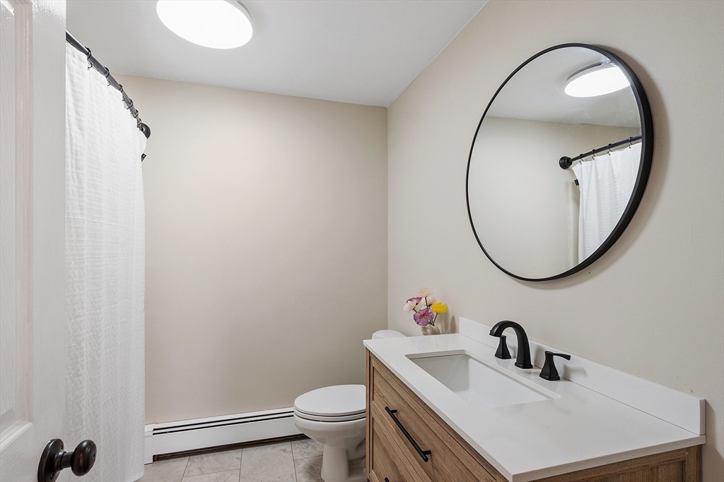 11 Syd Smith Road Westminster, MA 01473 - Photo 20 of 42 a bathroom with a sink mirror and toilet