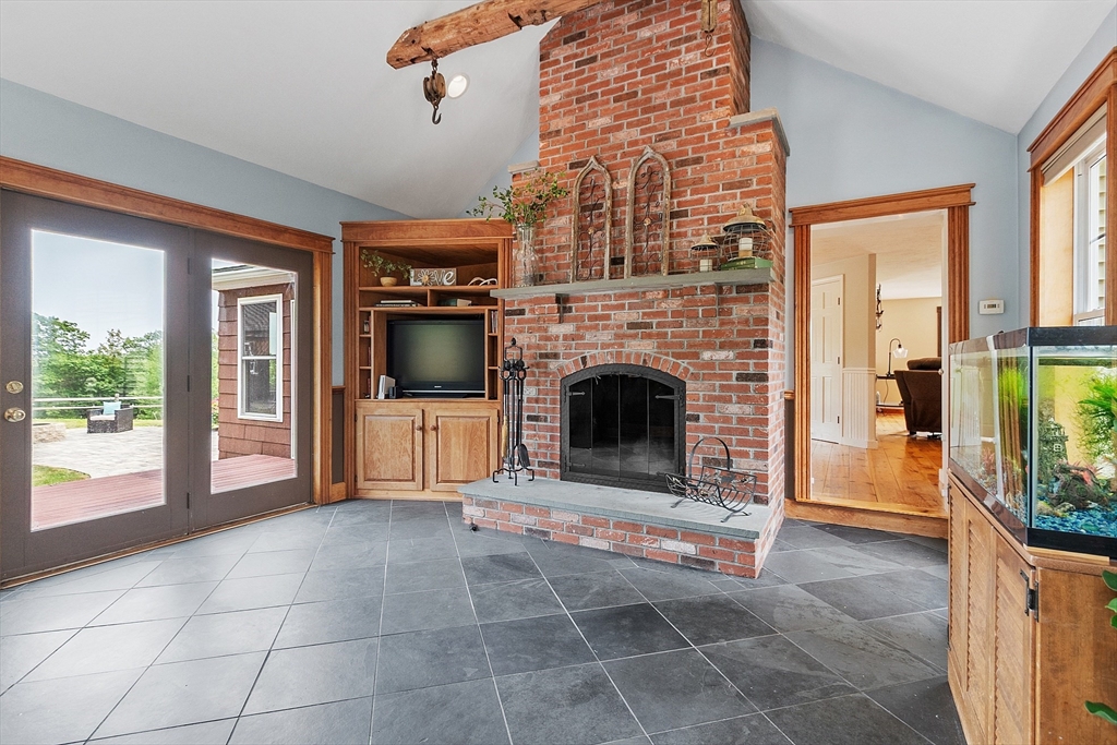 11 Syd Smith Road Westminster, MA 01473 - Photo 21 of 42 a living room with a fireplace a flat screen tv and a fireplace