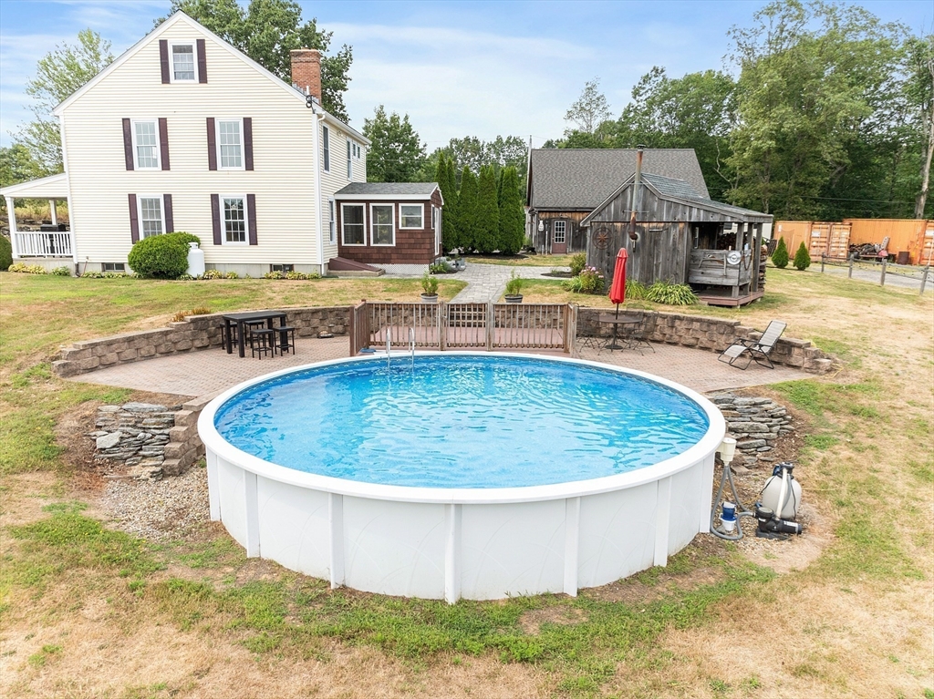 11 Syd Smith Road Westminster, MA 01473 - Photo 35 of 42 a view of a white house with a swimming pool and sitting area