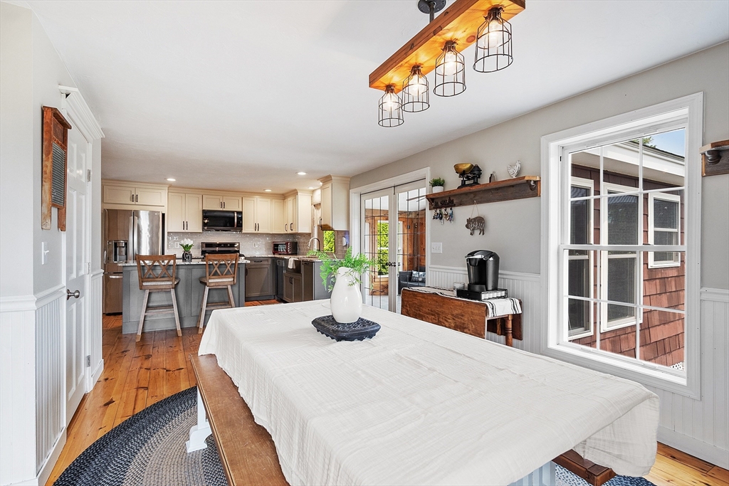11 Syd Smith Road Westminster, MA 01473 - Photo 6 of 42 a kitchen with stainless steel appliances kitchen island granite countertop a refrigerator a stove a sink dishwasher and white cabinets with wooden floor