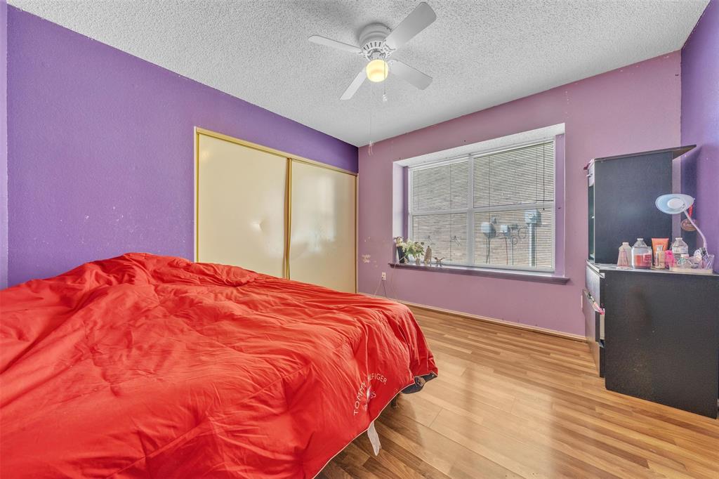3405 Tulip Lane Rowlett, TX 75089 - Photo 16 of 36 a bedroom with a bed and a window