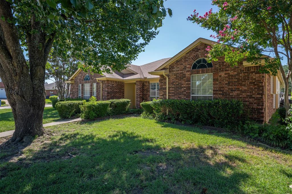 3405 Tulip Lane Rowlett, TX 75089 - Photo 2 of 36 a front view of a house with a yard