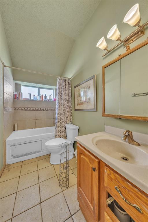 3405 Tulip Lane Rowlett, TX 75089 - Photo 21 of 36 a bathroom with a sink a toilet and a mirror
