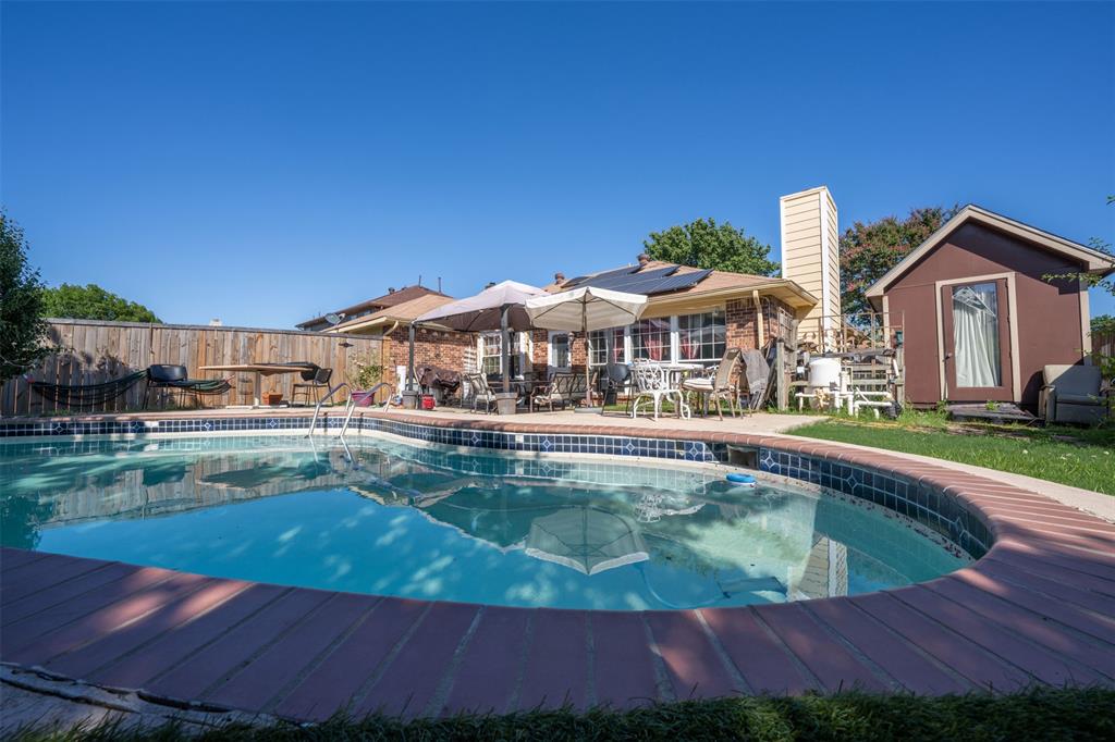 3405 Tulip Lane Rowlett, TX 75089 - Photo 29 of 36 a view of a house with swimming pool and sitting area