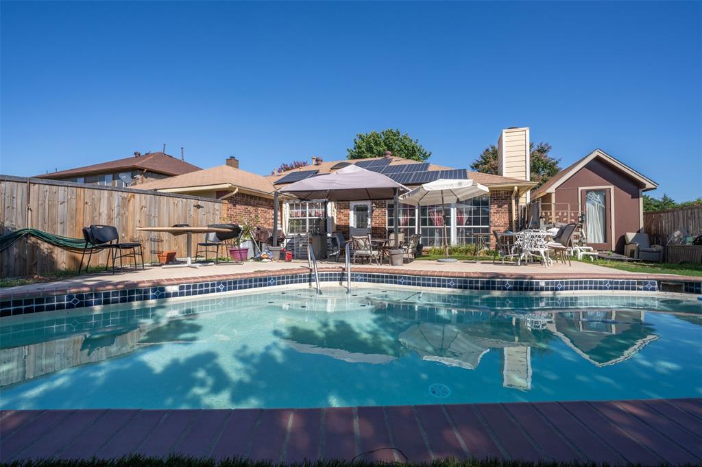 3405 Tulip Lane Rowlett, TX 75089 - Photo 30 of 36 a swimming pool view with a seating space and a garden view