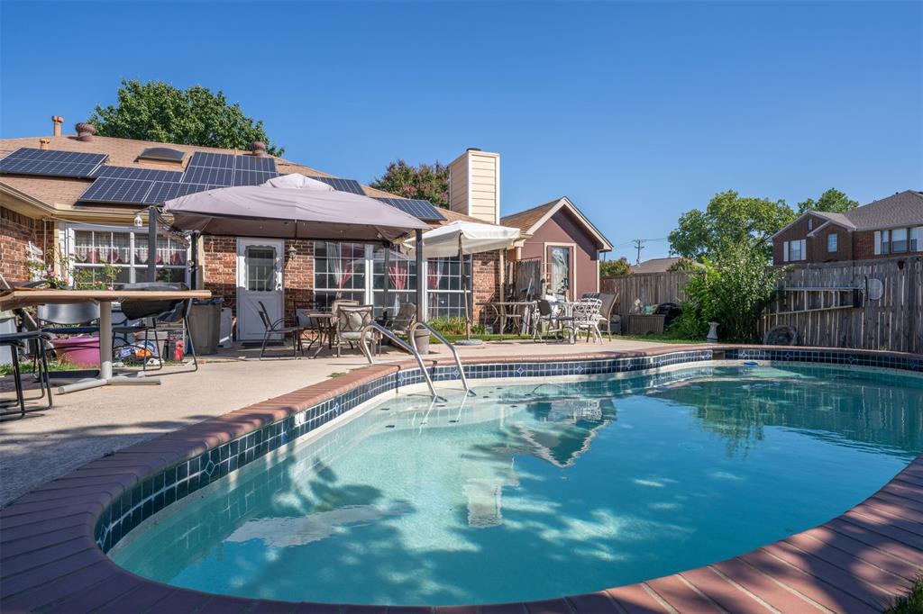 3405 Tulip Lane Rowlett, TX 75089 - Photo 32 of 36 a view of a house with swimming pool