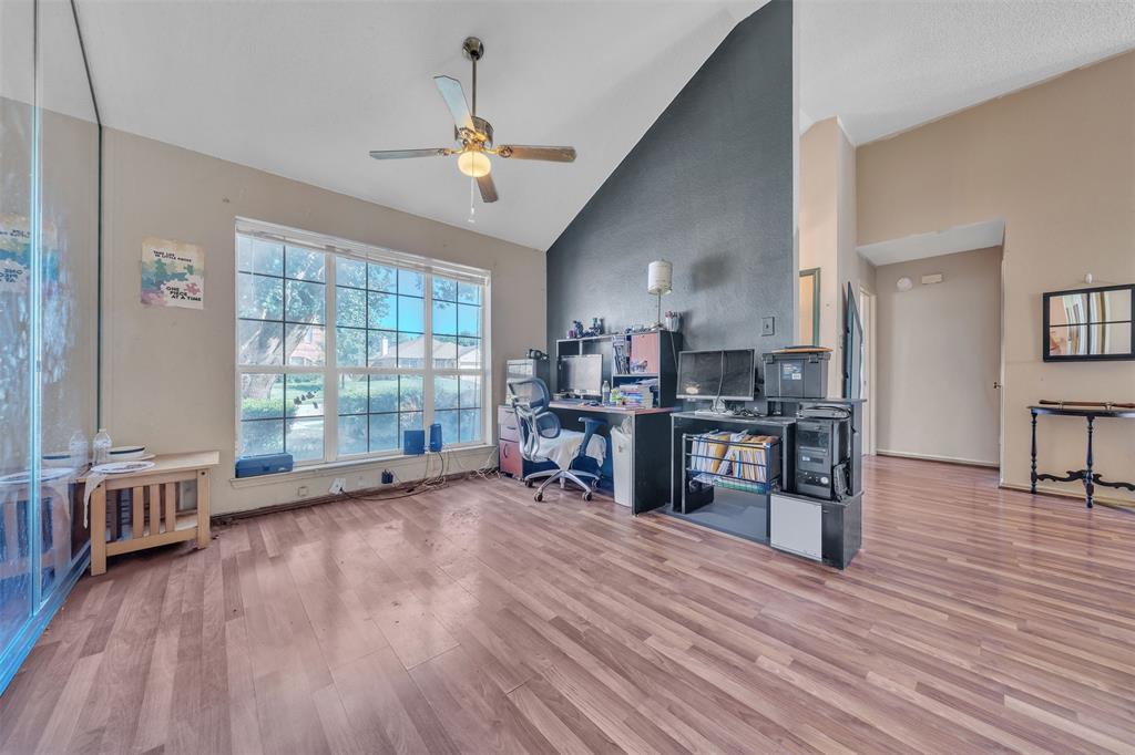 3405 Tulip Lane Rowlett, TX 75089 - Photo 6 of 36 a view of a room with wooden floor and furniture