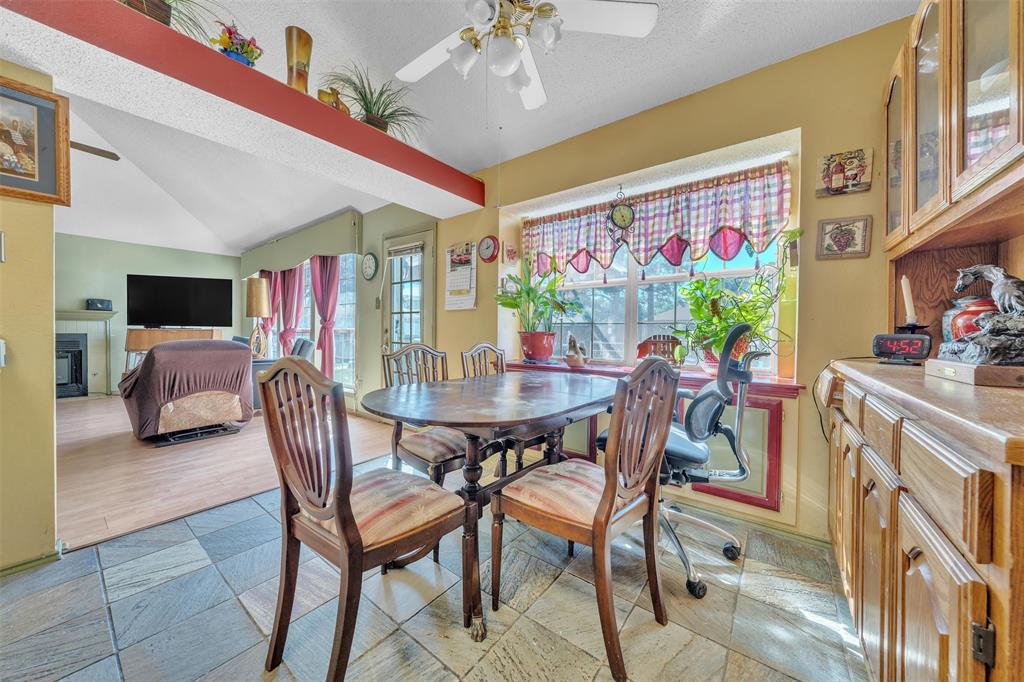 3405 Tulip Lane Rowlett, TX 75089 - Photo 7 of 36 a view of a dining room with furniture and a kitchen