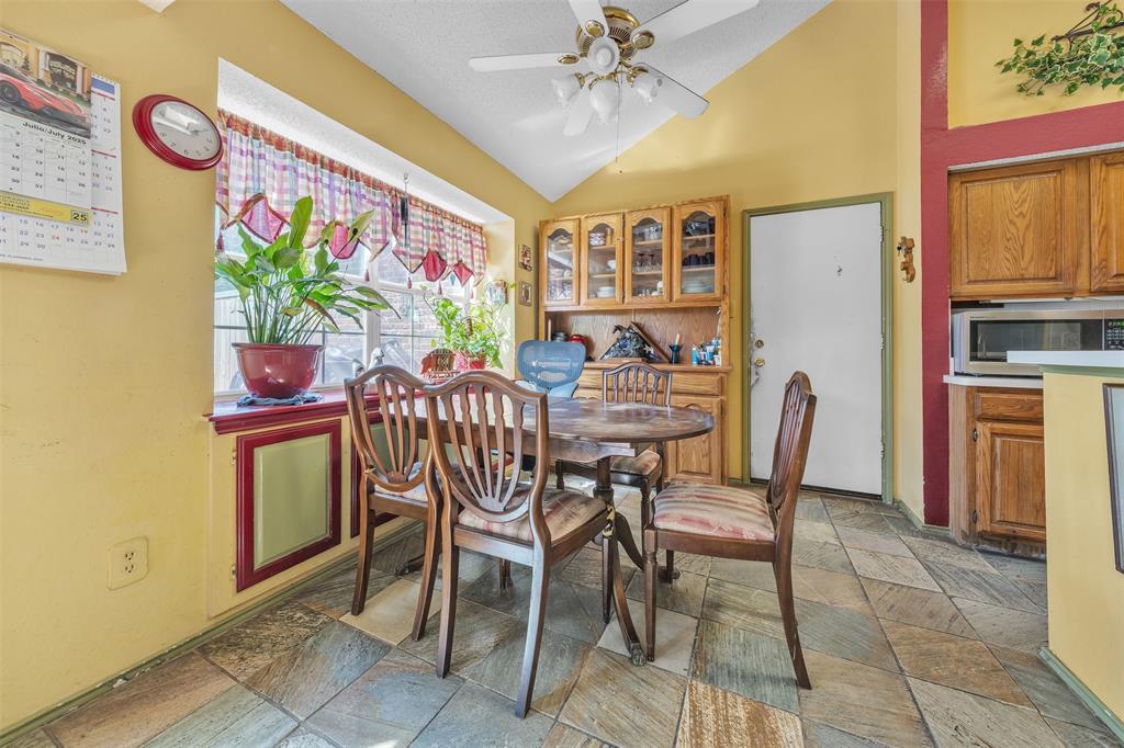3405 Tulip Lane Rowlett, TX 75089 - Photo 8 of 36 a dining room with furniture and window