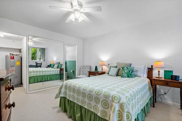 a bedroom with a balcony a bed and a chandelier