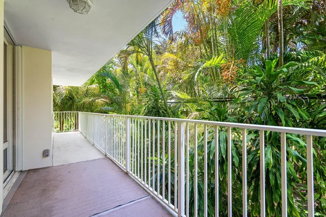 a view of a balcony with wooden floor