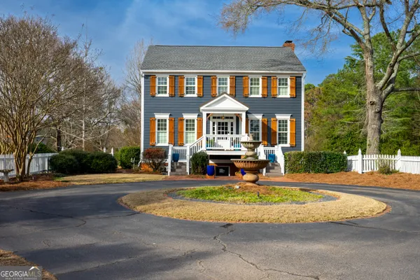 an aerial view of a house with outdoor space