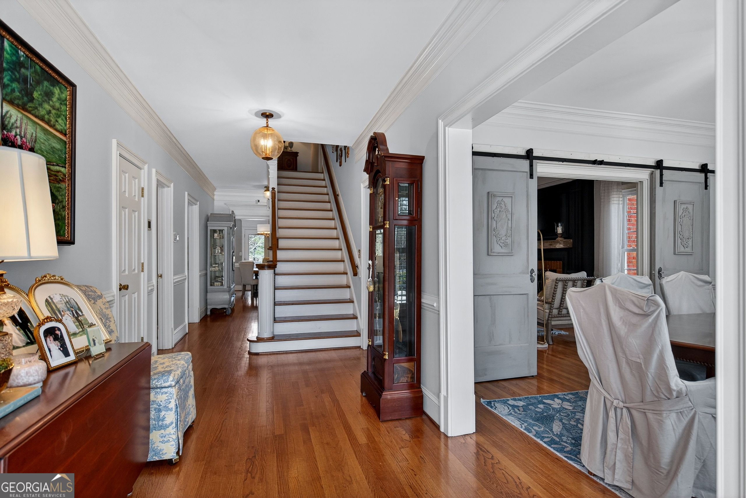 638 Cameron Mill Road LaGrange, GA 30240 - Photo 11 of 72 a view of a hallway with wooden floor and staircase