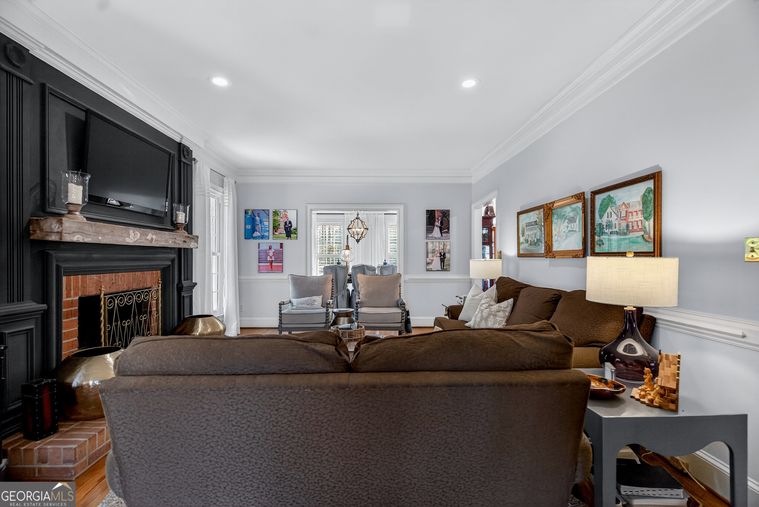 638 Cameron Mill Road LaGrange, GA 30240 - Photo 15 of 72 a living room with furniture a fireplace and a flat screen tv