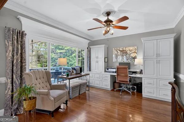 a view of a dining room with furniture wooden floor and chandelier