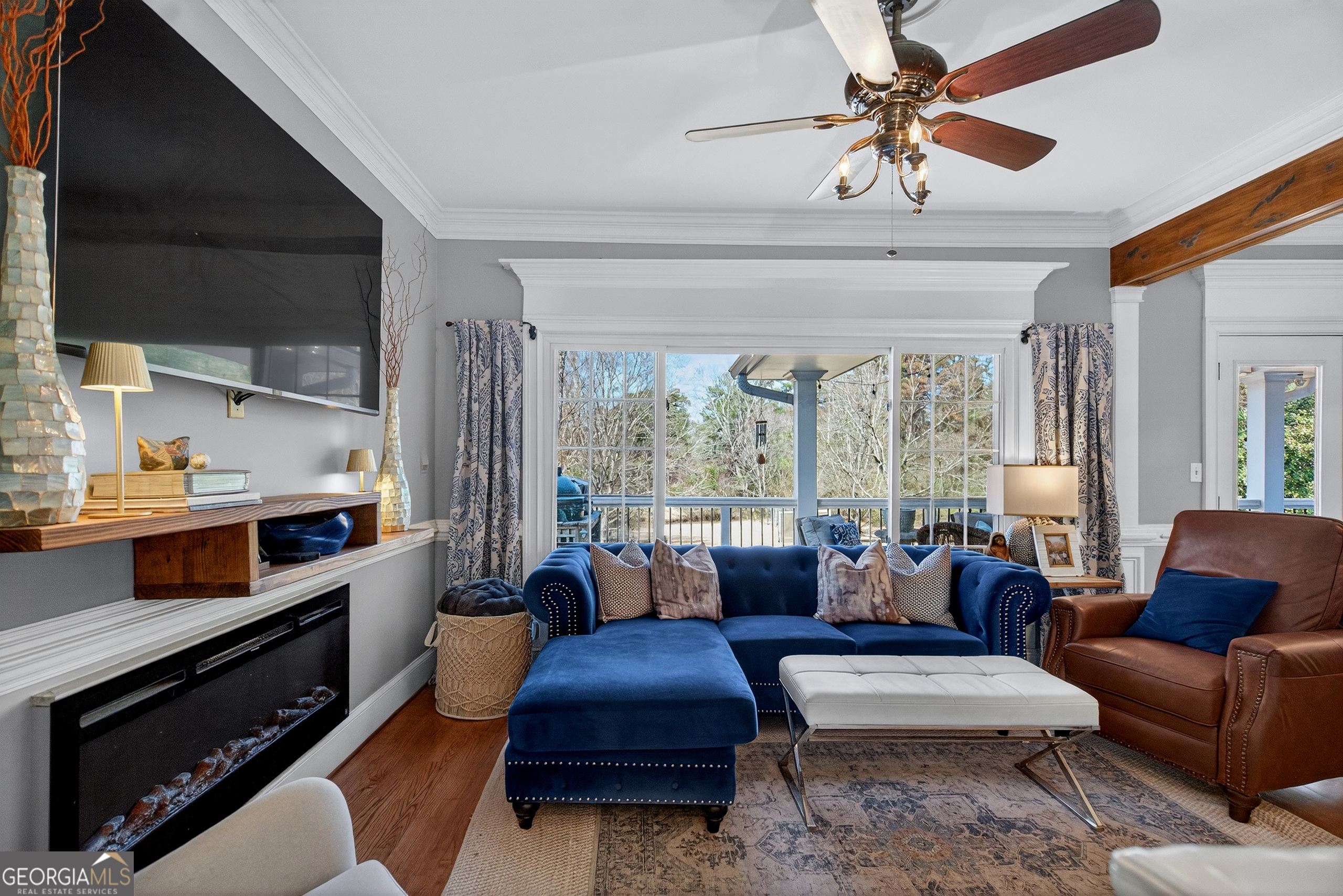 638 Cameron Mill Road LaGrange, GA 30240 - Photo 26 of 72 a living room with furniture fireplace and a large window