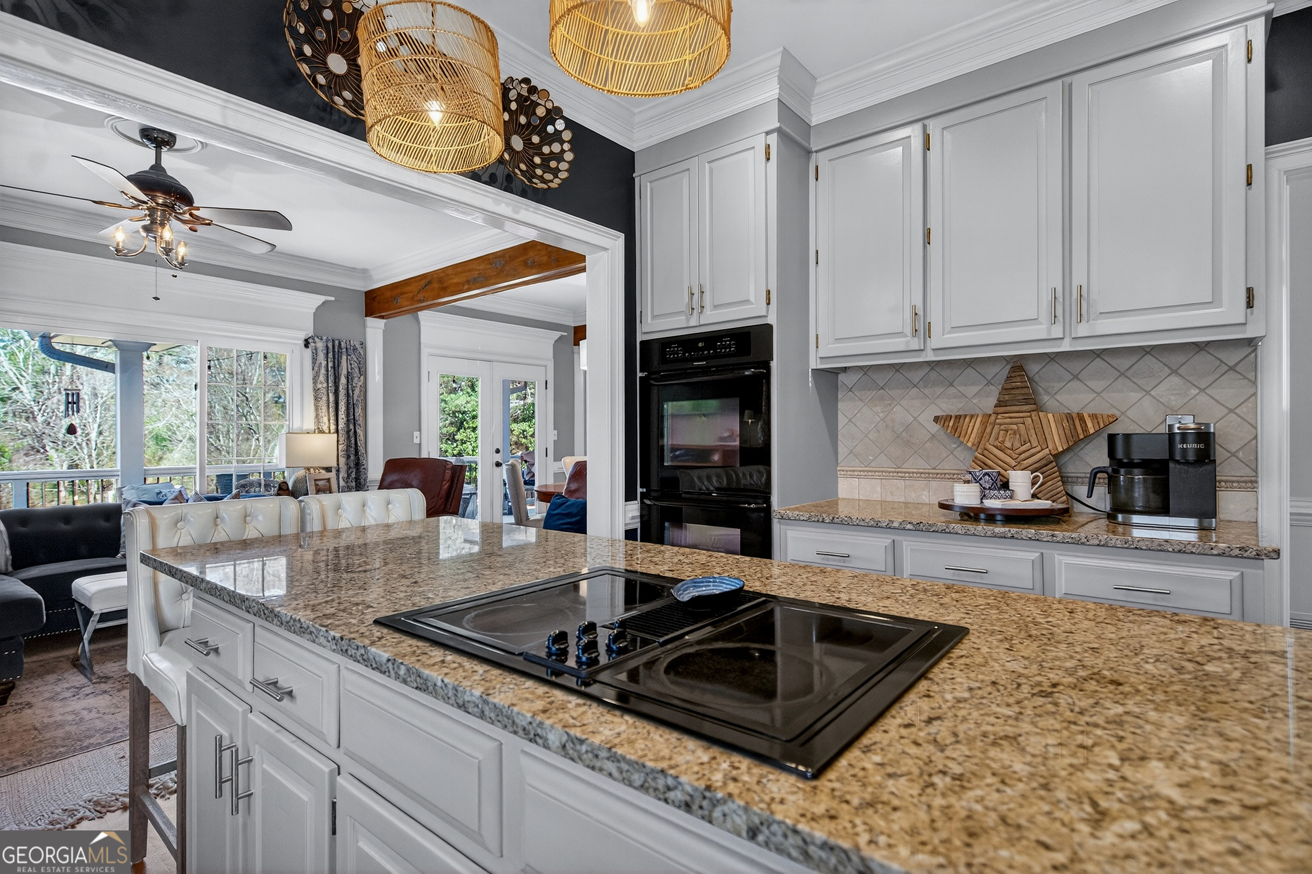 638 Cameron Mill Road LaGrange, GA 30240 - Photo 29 of 72 a kitchen with granite countertop a sink a stove and cabinets