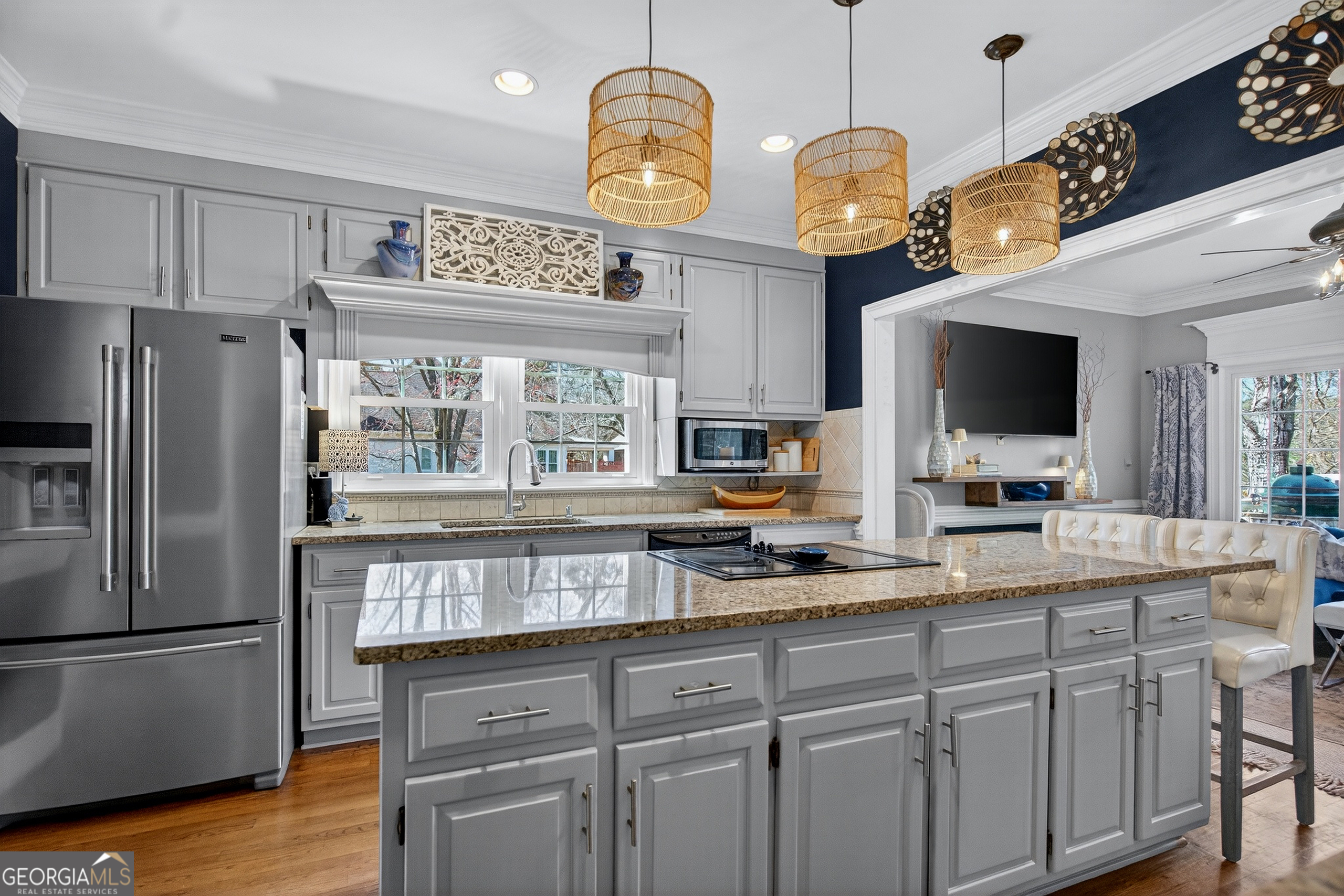 638 Cameron Mill Road LaGrange, GA 30240 - Photo 30 of 72 a kitchen with cabinets stainless steel appliances and wooden floor