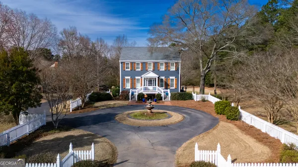 a front view of a house with yard