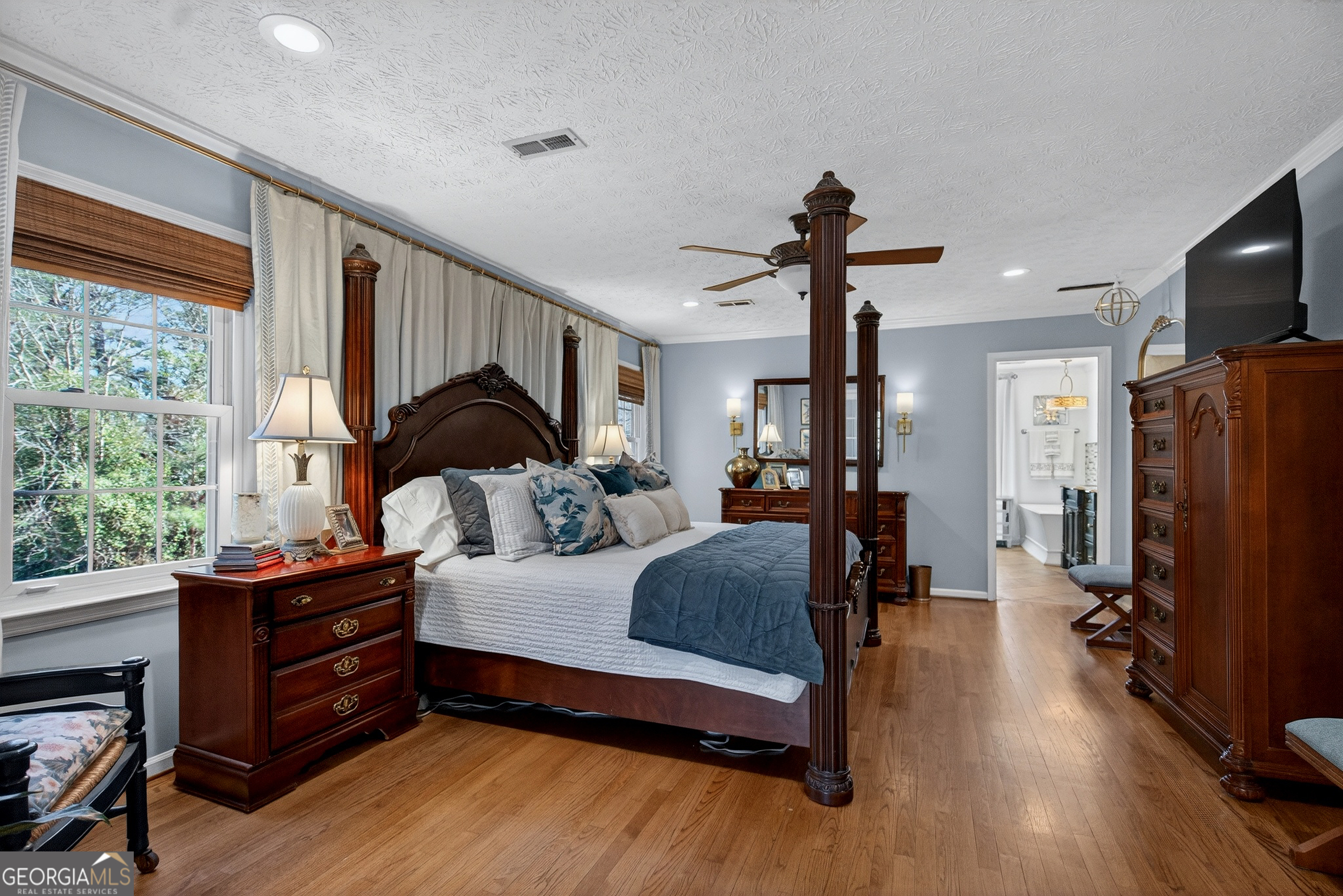 638 Cameron Mill Road LaGrange, GA 30240 - Photo 36 of 72 a bedroom with a bed and wooden floor