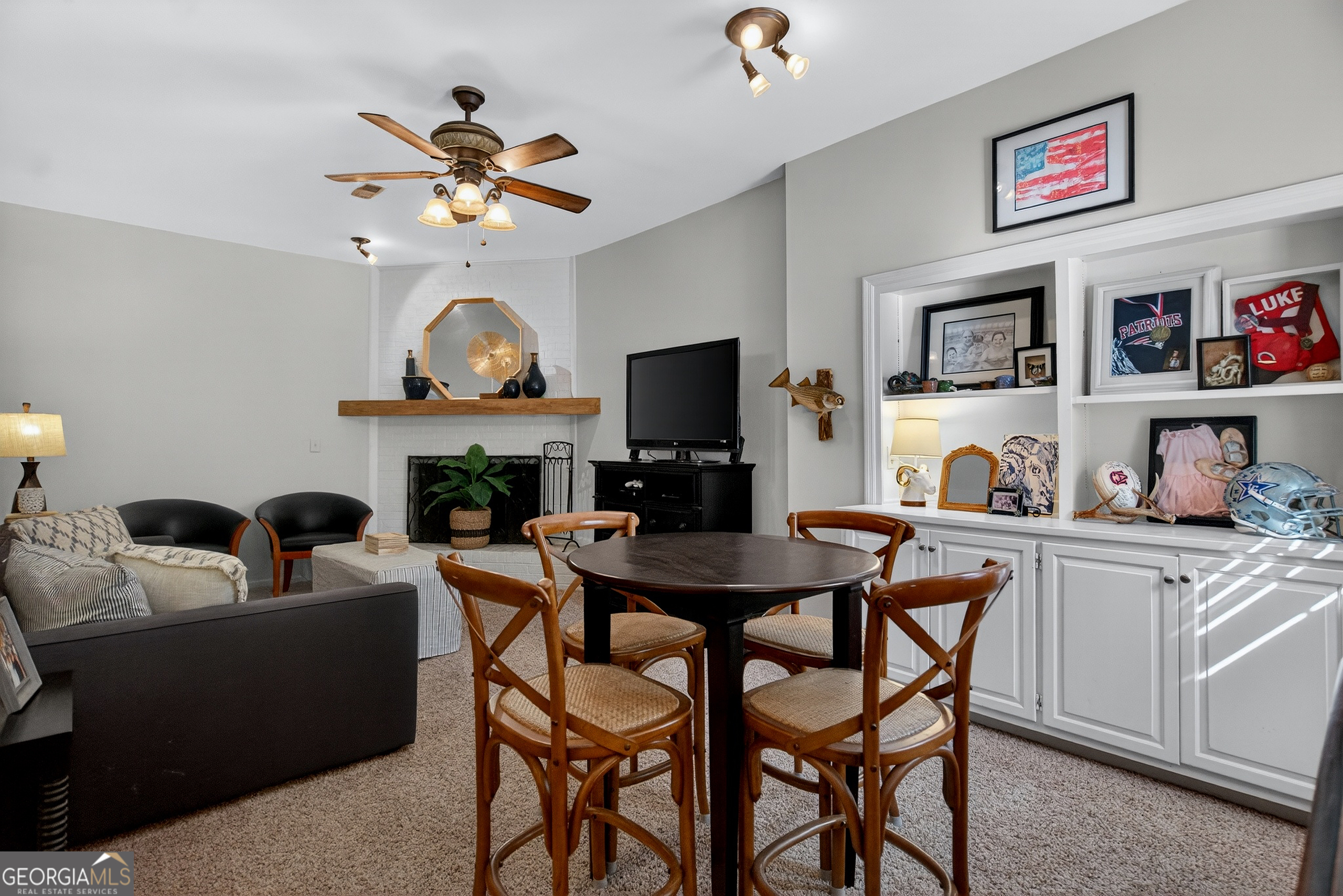 638 Cameron Mill Road LaGrange, GA 30240 - Photo 51 of 72 a living room with furniture a fireplace and a flat screen tv