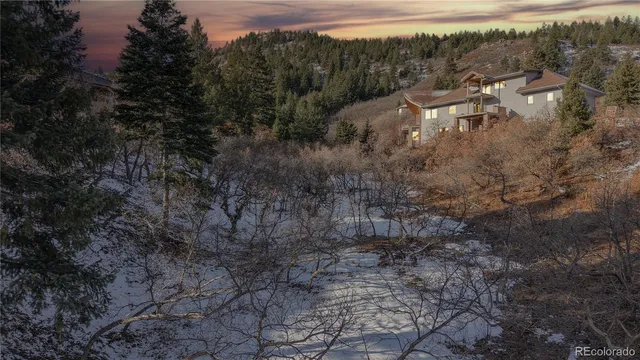 a view of a wooden house with a yard