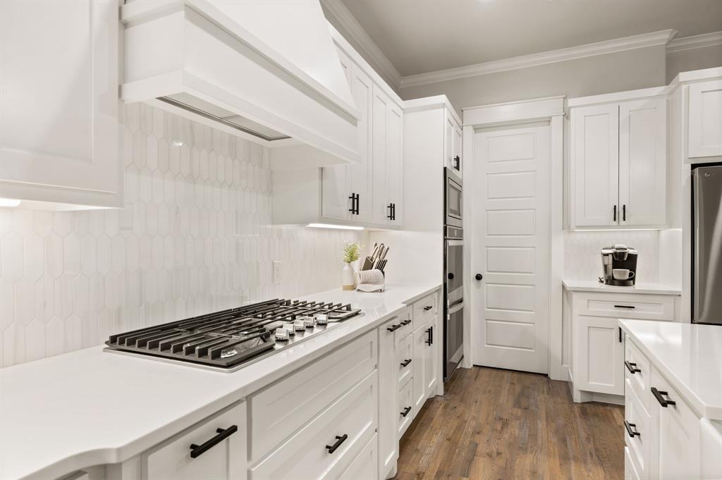 200 Clayton Crossing Springtown, TX 76082 - Photo 13 of 40 a kitchen with stainless steel appliances a stove a sink and a refrigerator