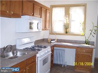 86 Lamport Road Upper Darby, PA 19082 - Photo 4 of 6 a kitchen with a sink stove and cabinets