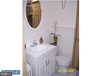 86 Lamport Road Upper Darby, PA 19082 - Photo 6 of 6 a bathroom with a sink a toilet and a mirror