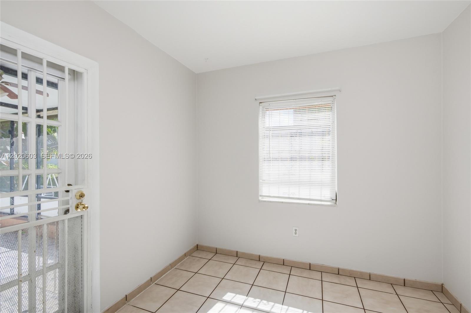 3750 Southwest 27th Street Miami, FL 33134 - Photo 9 of 41 a view of an empty room with a window