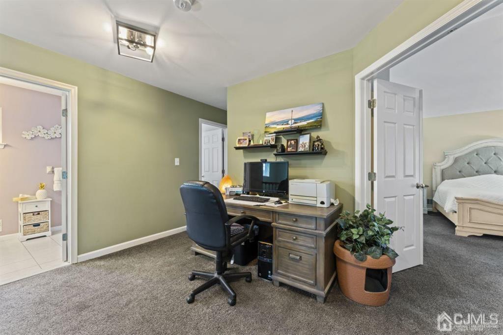 14 Reddington Drive Old Bridge, NJ 07747 - Photo 29 of 40 a view of a workspace with furniture and a window