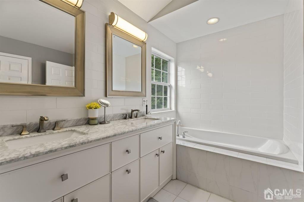 14 Reddington Drive Old Bridge, NJ 07747 - Photo 34 of 40 a bathroom with a granite countertop double vanity sink and mirror