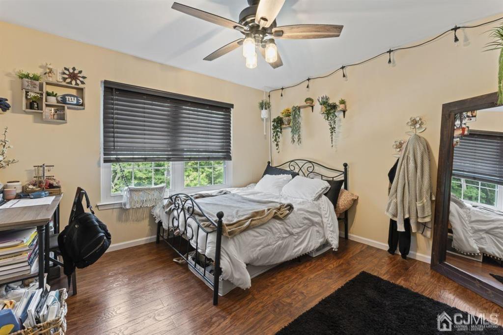 14 Reddington Drive Old Bridge, NJ 07747 - Photo 37 of 40 a bedroom with a bed next to a window with the outer view