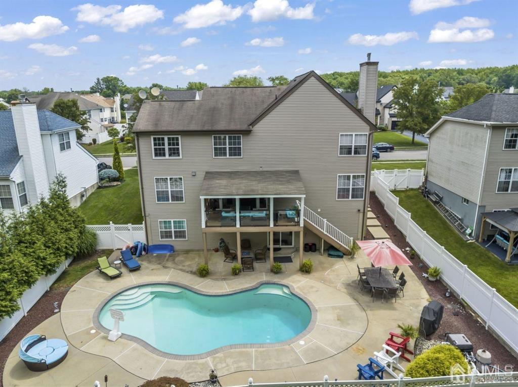 14 Reddington Drive Old Bridge, NJ 07747 - Photo 7 of 40 an aerial view of a house with swimming pool and furniture