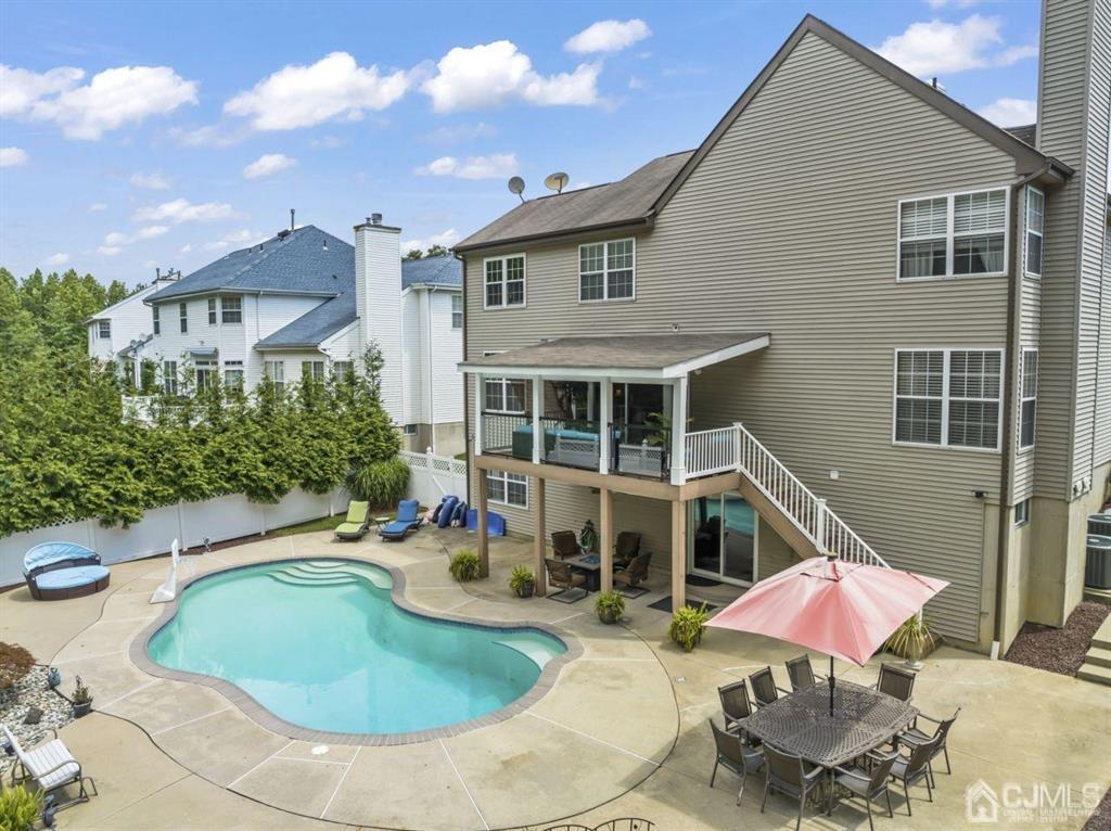 14 Reddington Drive Old Bridge, NJ 07747 - Photo 8 of 40 a view of a house with pool and chairs