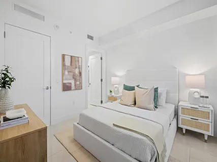 a bedroom with a bed and a table