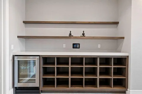 a living room with furniture a large window and yard