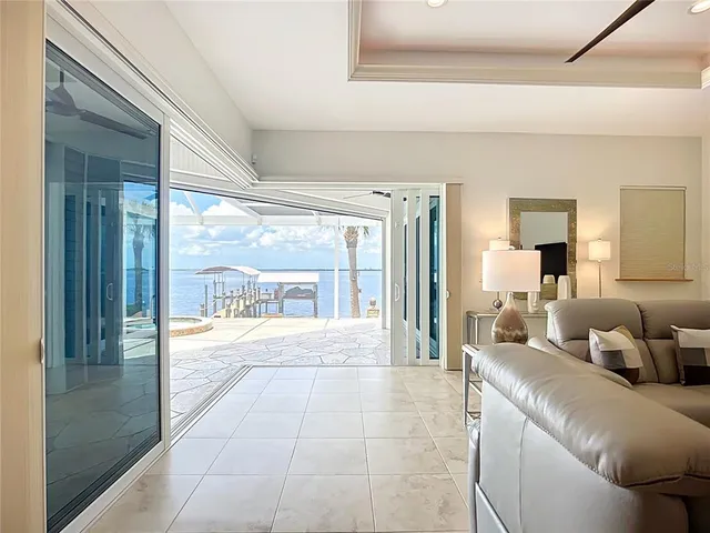 a large white kitchen with a large island
