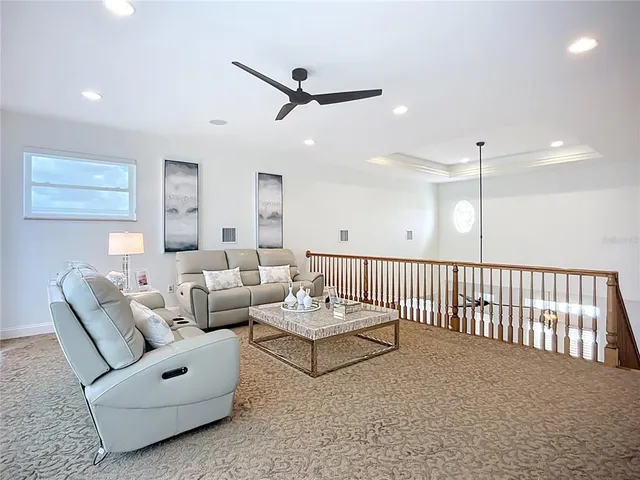 a bathroom with a granite countertop toilet sink and mirror