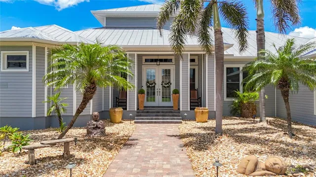 a view of a livingroom with furniture and staircase