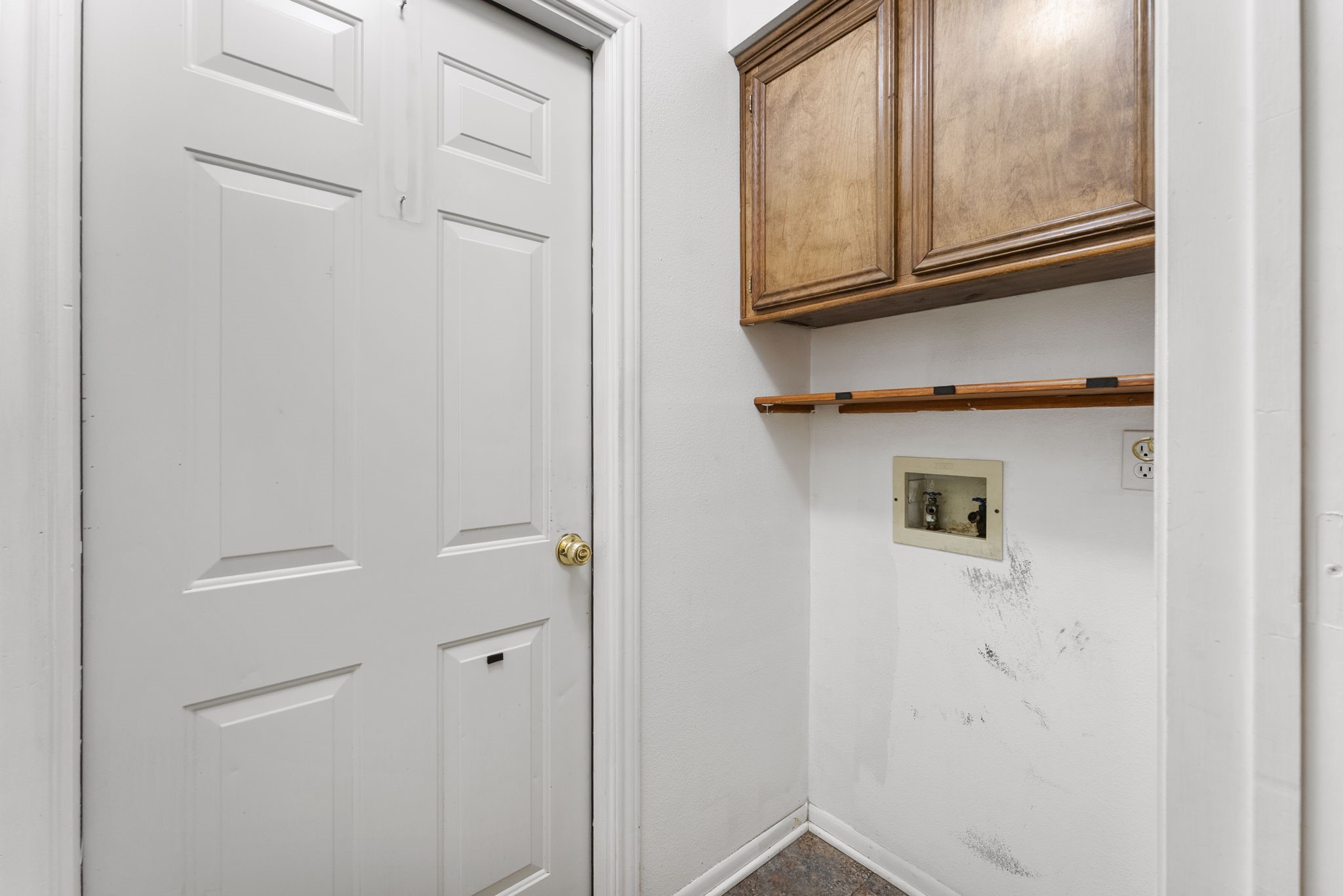 202 Sunset Boulevard Conroe, TX 77303 - Photo 21 of 50 Discover an efficient laundry room featuring ample storage with stylish cabinetry, perfect for keeping your essentials organized.