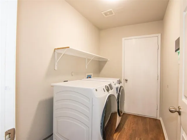 a utility room with dryer and washer