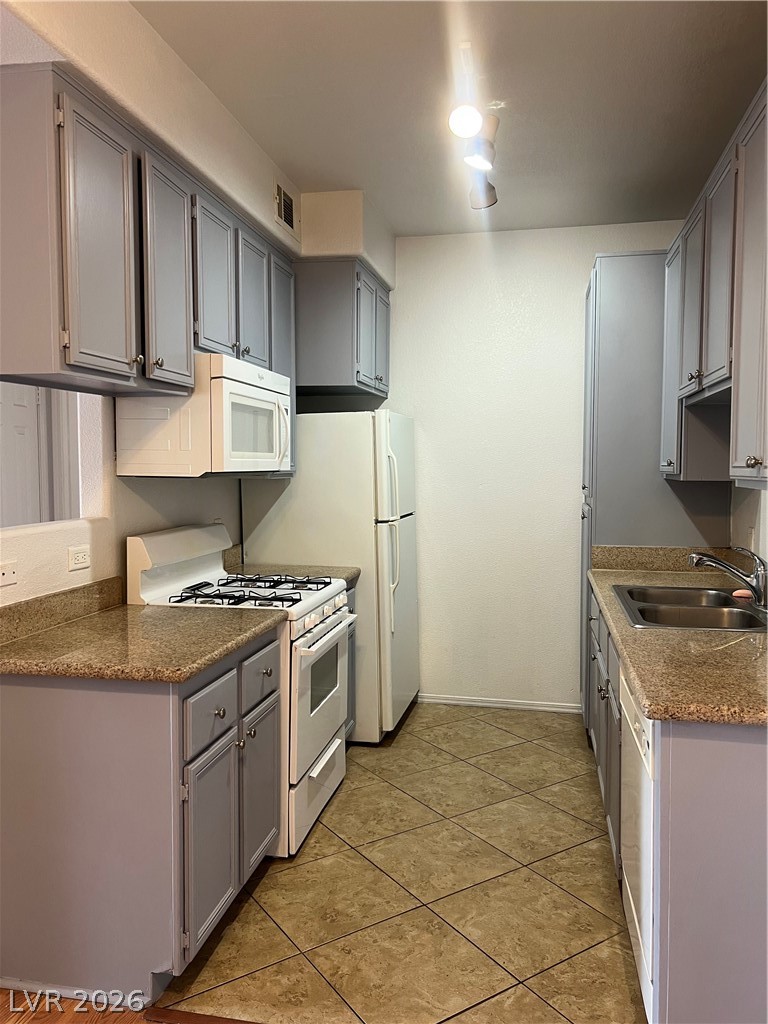 3318 North Decatur Boulevard, Unit 1174 Las Vegas, NV 89130 - Photo 6 of 23 This bright kitchen features ample counter space and appliances, perfect for daily living.